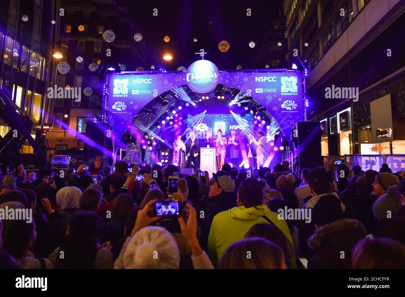 X Factor 2016 winner Matt Terry, and fellow X Factor finalists 5 After Midnight, pose with Capital's Roman Kemp and Vick Hope at the Oxford Street Christmas lights switch on in central London, in partnership with the NSPCC's ÔLight Up Christmas for Children' campaign. Stock Photo