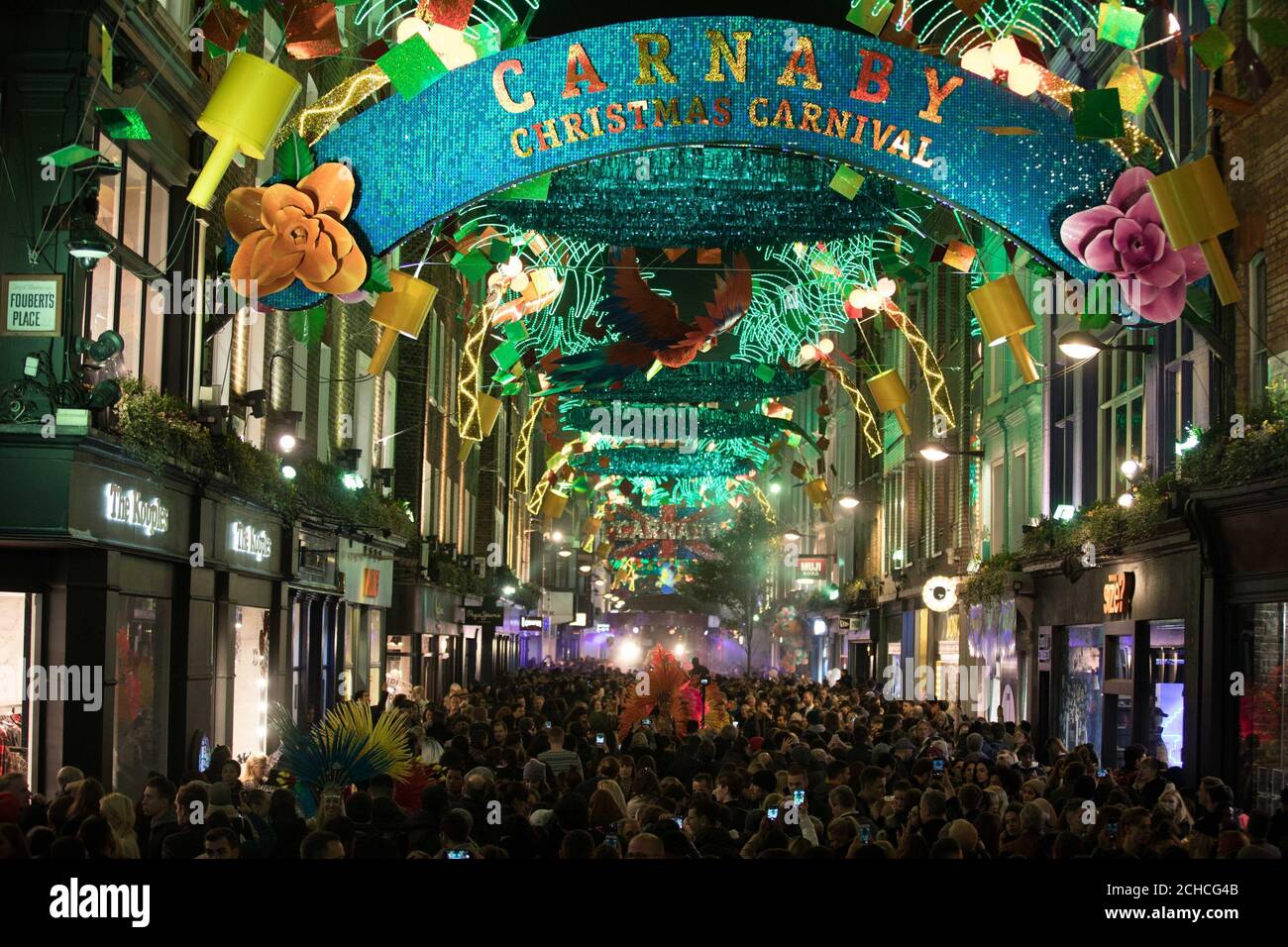 EDITORIAL USE ONLY Crowds gather for the Carnaby Christmas lights