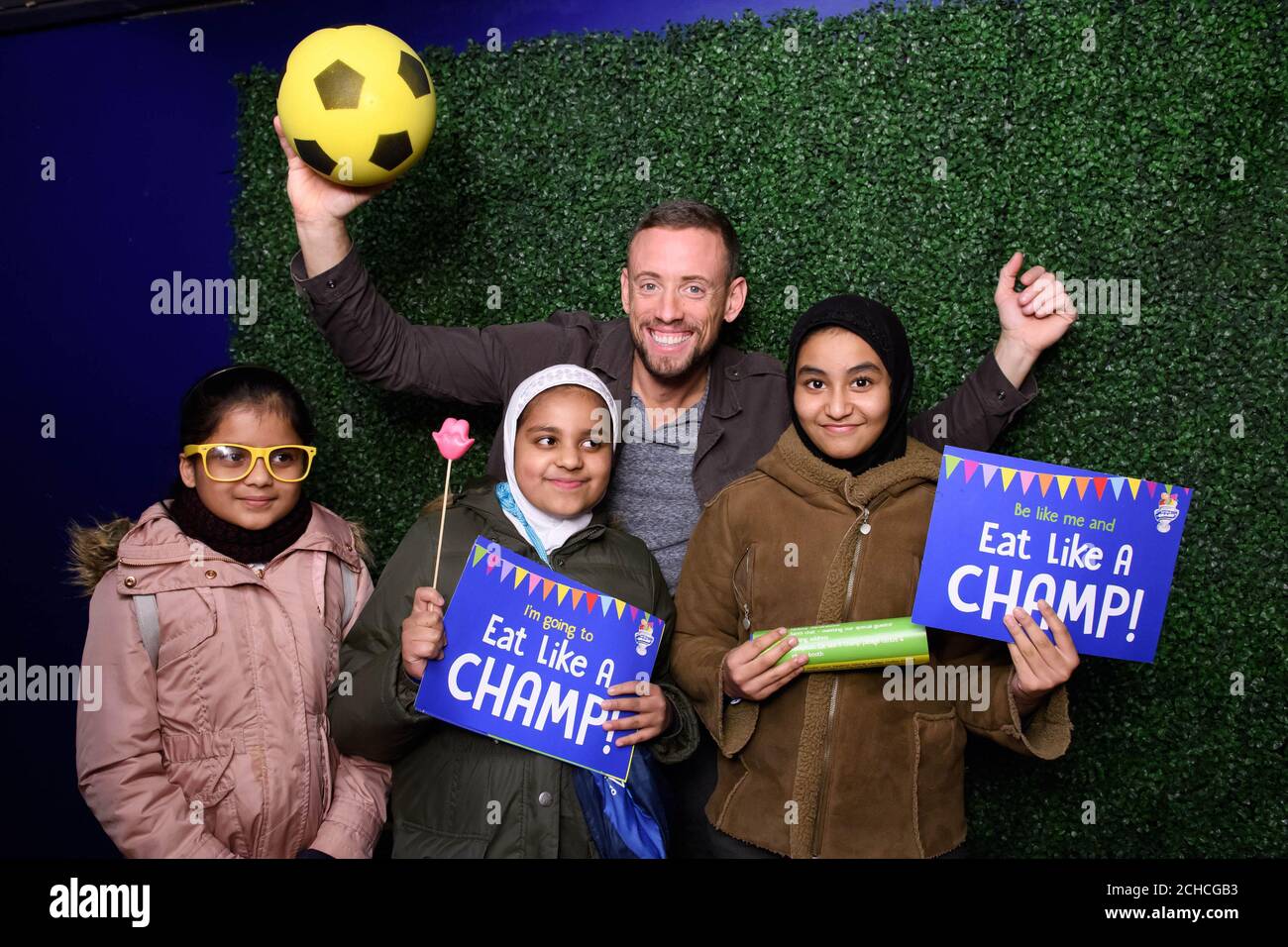 EDITORIAL USE ONLY Radio presenter Sam Pinkham with pupils from schools in Newham at the Eat Like A Champ showcase, a free healthy eating education programme supported by Danone, which aims to promote good nutrition and lifestyle, at Stratford Circus Arts Centre in London.  Stock Photo