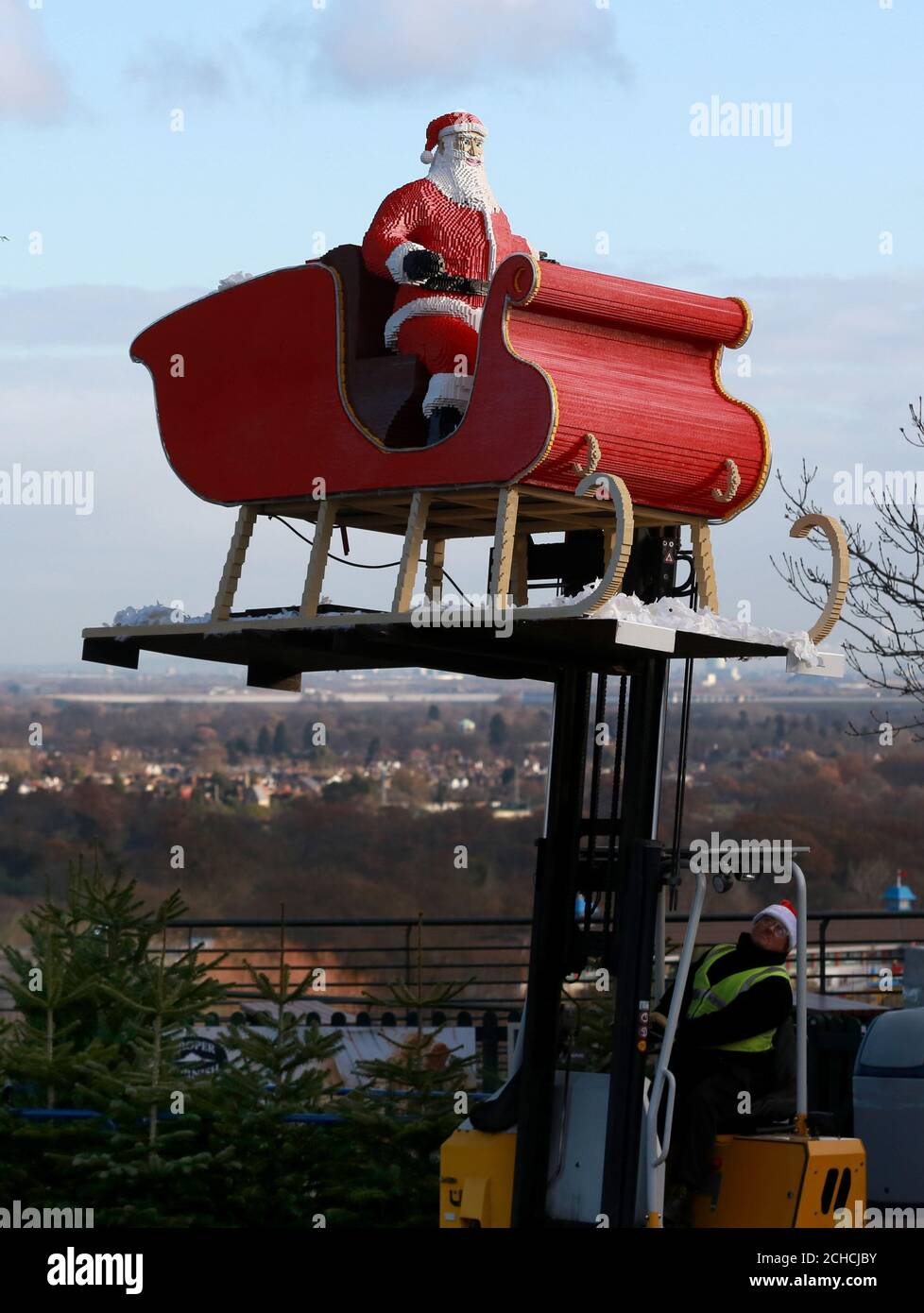 EDITORIAL USE ONLY Tony Down delivers Father Christmas and his Sleigh, part of the 15-metre long LEGO model, to the Legoland Windsor Resort in Berkshire. Stock Photo