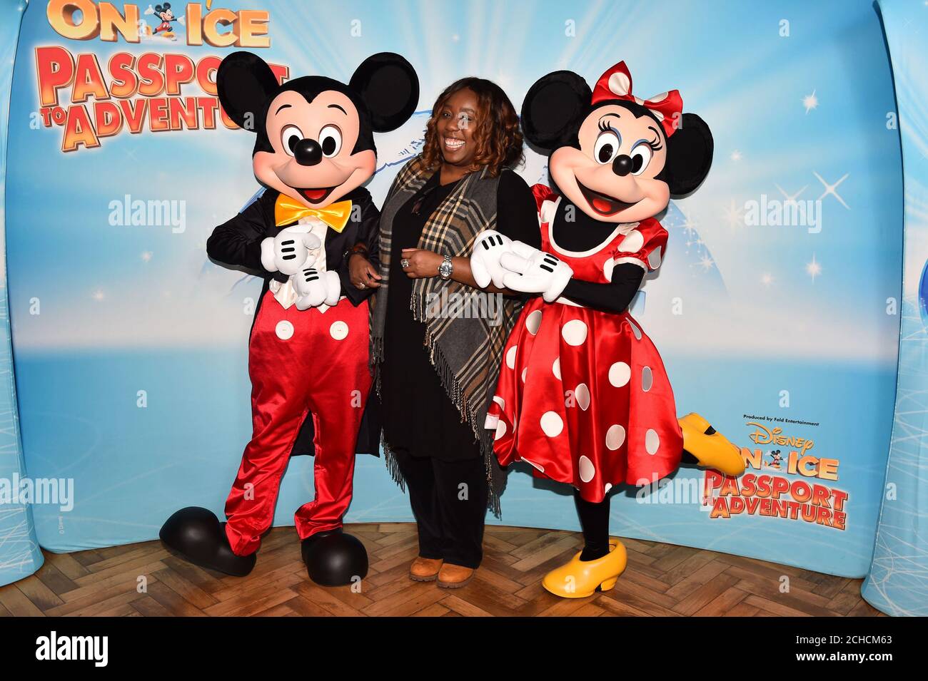 Chizzy Akudolu meets Mickey and Minnie Mouse at the opening night of Disney On Ice Passport to Adventure at the O2 Arena from December 20th until December 30th, London. Stock Photo