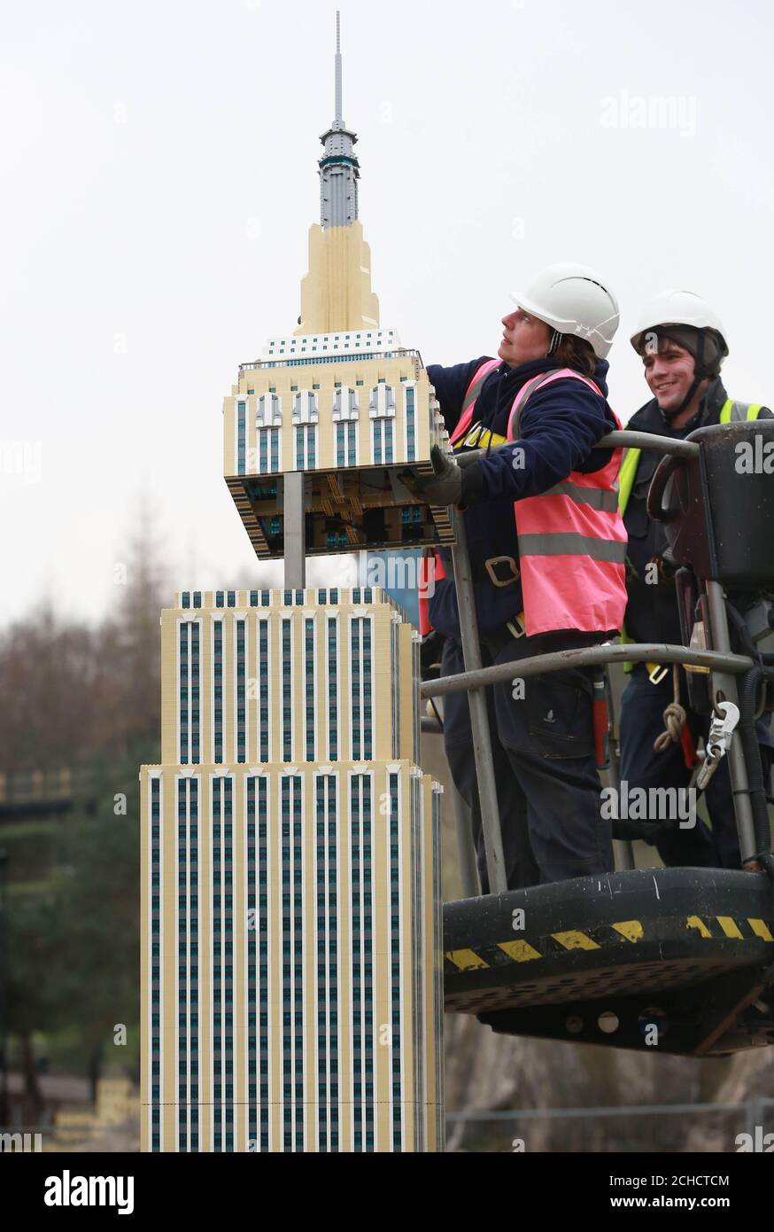 EDITORIAL USE ONLY Model makers Paula Laughton and Tim McPhee put the  finishing touches to a new LEGO Empire State Building, which has 71,040  bricks and took 700 hours to build, at