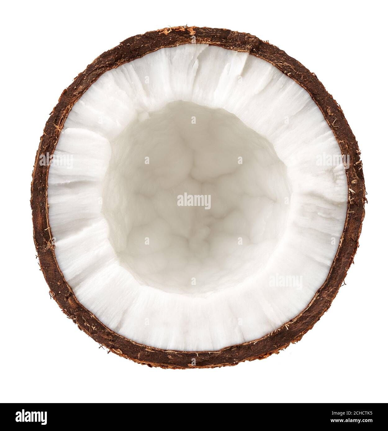 Half coconut isolated on white. Top view of coconut. Stock Photo