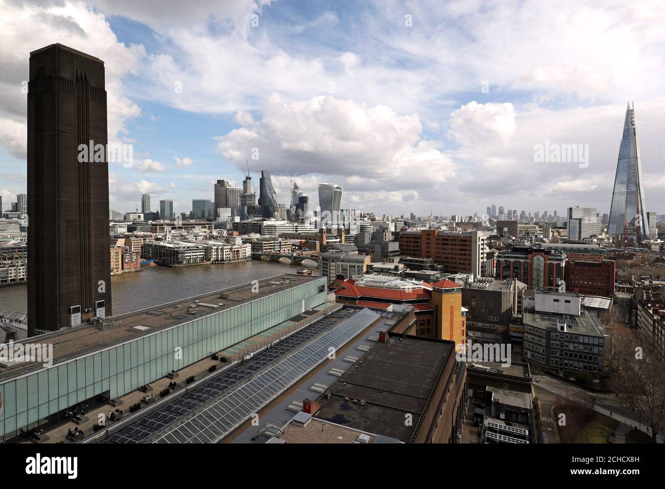 The Turbine Hall, City of London, Canary Wharf and The Shard as seen from the viewing deck of the Blavatnik Building, Tate Modern, London. Stock Photo