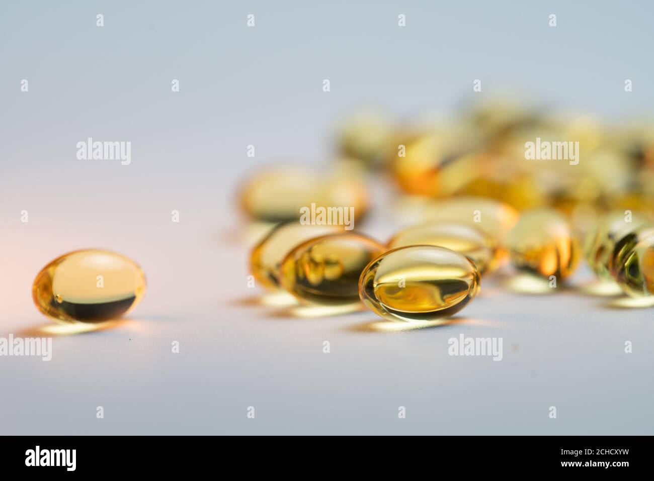 Close up golden Omega 3 fatty acids capsules Stock Photo Alamy