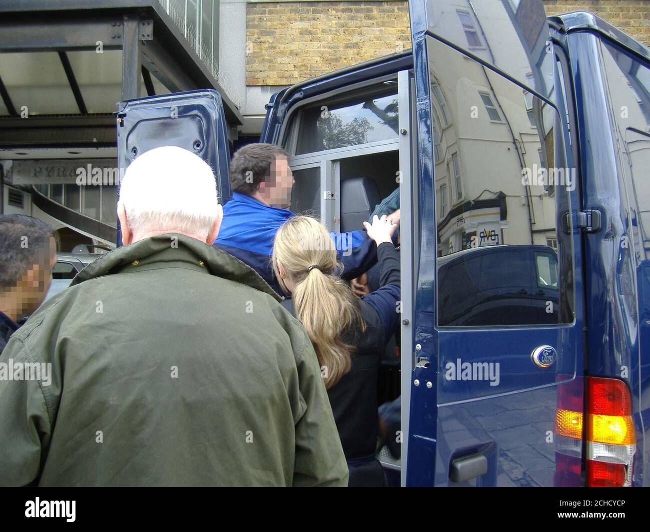 Home Secretary John Reid (2nd left) joins immigration officers on a ...