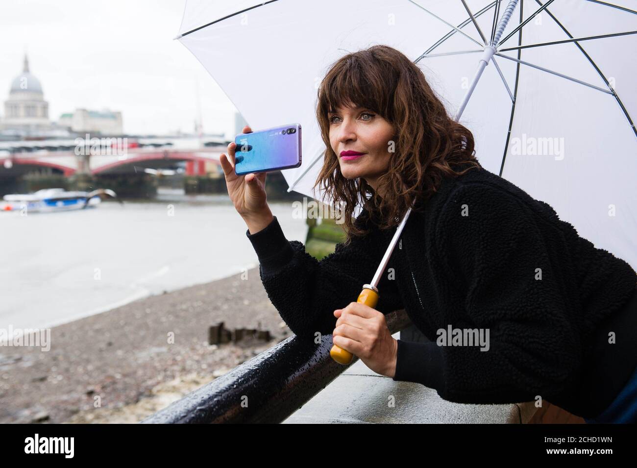 EDITORIAL USE ONLY Helena Christensen is photographed by competition winners at a Huawei P20 Pro photography masterclass, at OXO Tower Brasserie in London. Stock Photo