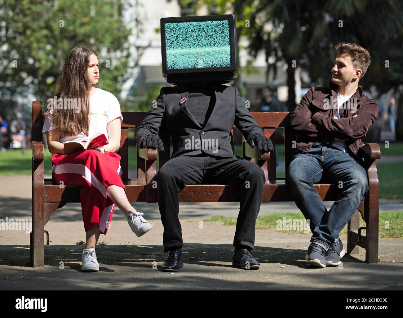 Embargoed to 0001 Thursday May 24 EDITORIAL USE ONLY  A person with a TV head in Soho Square, London, as part of a campaign by Samsung to launch their new QLED TV range. Stock Photo