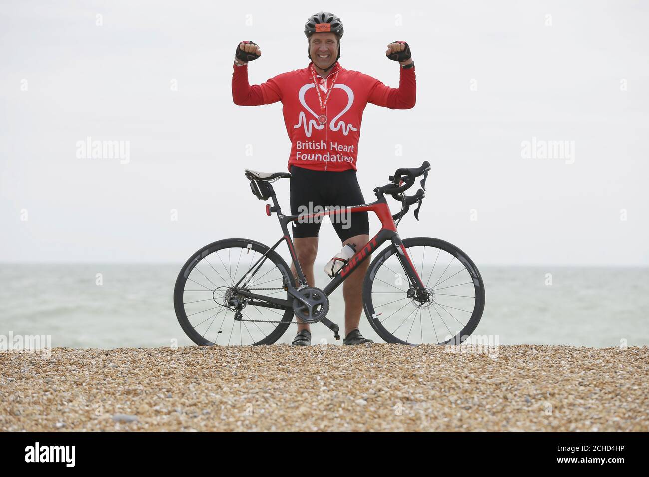 David Seaman celebrates after finishing the British Heart Foundation's London to Brighton Bike Ride 2018. PRESS ASSOCIATION. Photo. Picture date: Sunday June 17, 2018. David joined 16,000 cyclists this year, helping raise around £3million for the charity's life-saving research. Heart and circulatory disease is responsible for around 150,000 deaths each year. Photo credit should read: Tim Ireland/PA Wire Stock Photo