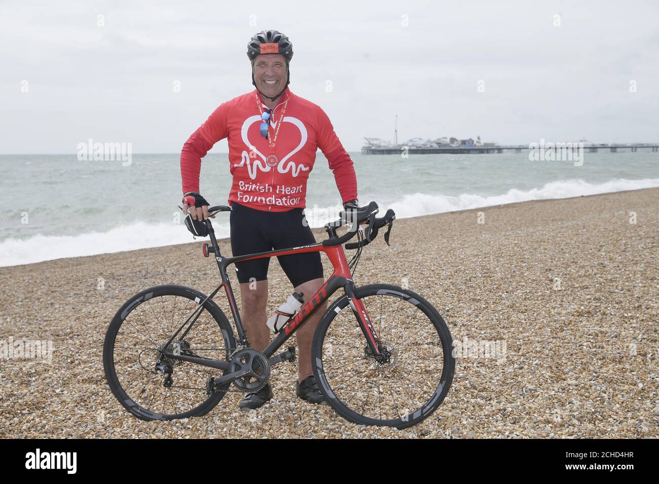 David Seaman celebrates after finishing the British Heart Foundation's London to Brighton Bike Ride 2018. PRESS ASSOCIATION. Photo. Picture date: Sunday June 17, 2018. David joined 16,000 cyclists this year, helping raise around £3million for the charity's life-saving research. Heart and circulatory disease is responsible for around 150,000 deaths each year. Photo credit should read: Tim Ireland/PA Wire Stock Photo