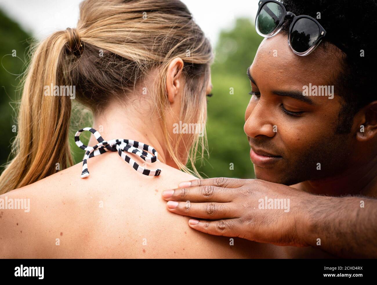 To celebrate the summer and highlight the importance of skin safety, Boots UK is encouraging the British public to 'have each other's backs' and work together to keep safe when it comes to sun protection and checking for signs of melanoma. Stock Photo