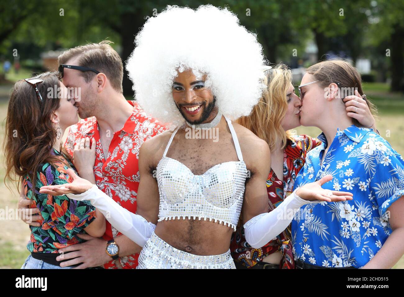 Embargoed to 0001 Friday June 22 EDITORIAL USE ONLY Mercutio, played by Michael Duke, from the upcoming Secret Cinema presents William Shakespeare's Romeo + Juliet, is joined by couples representing the Hawaiian shirt clad Montagues and Capulets to celebrate National Kissing Day and announce an additional 15,000 tickets going on sale, in London. Stock Photo