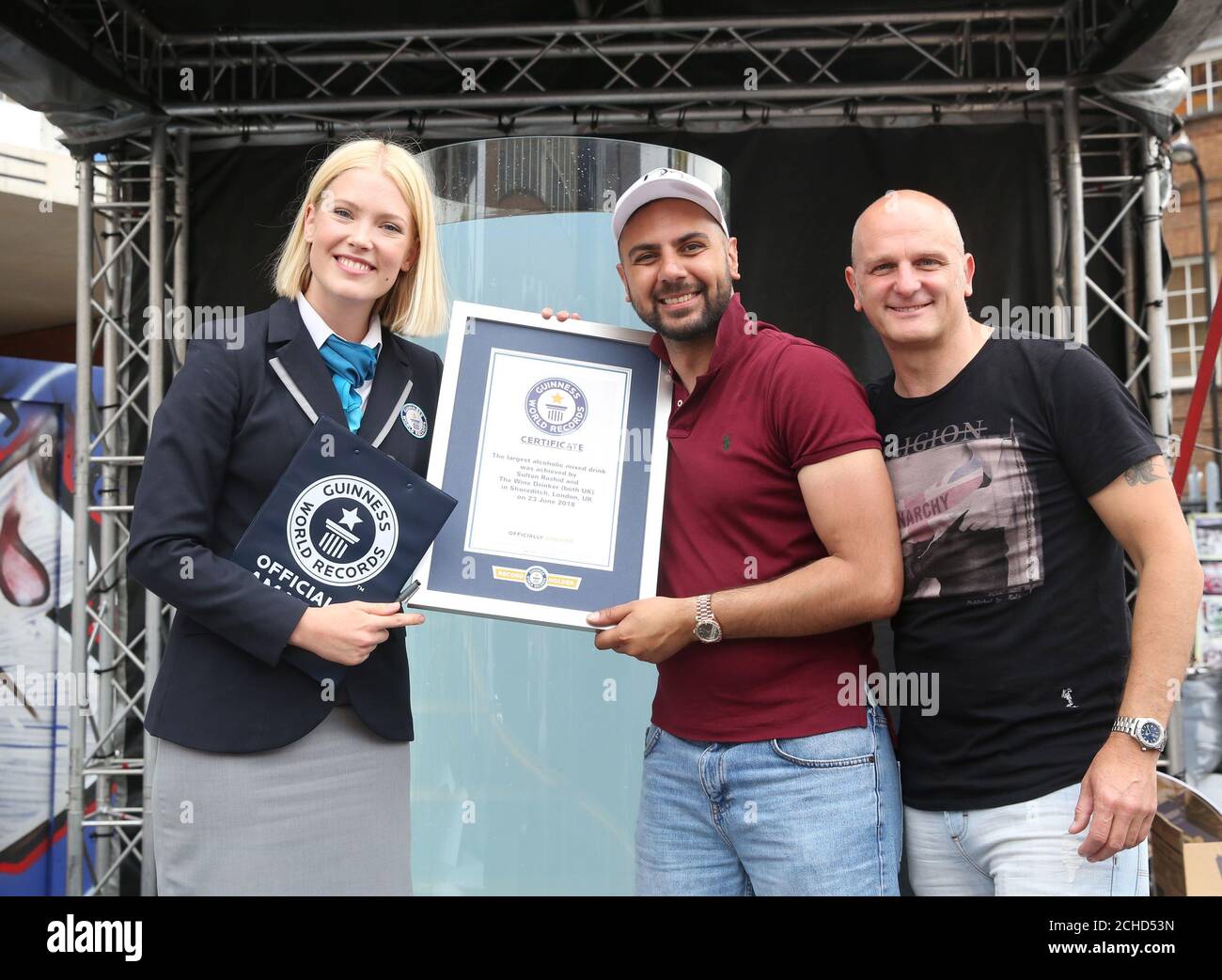 I (left to right) Adjudicator Sofia Greenacre, Sultan Rashid and Matthew Edwards after The Wine Drinker set a Guinness World Record for creating the world's largest alcoholic mixed drink at Urban Food Fest in Shoreditch. Stock Photo