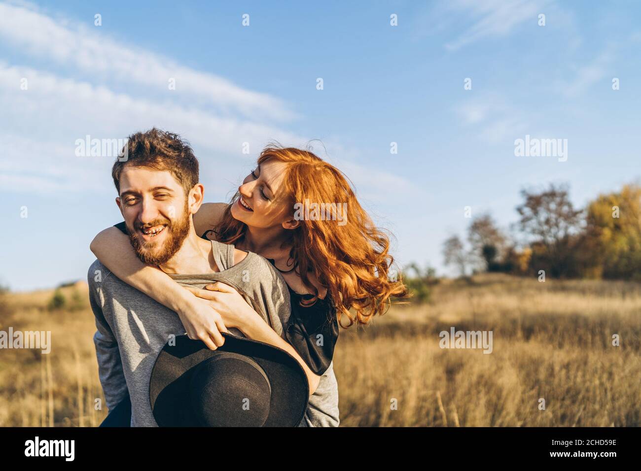 Pretty young romantic couple spend time together outdoor Stock Photo ...