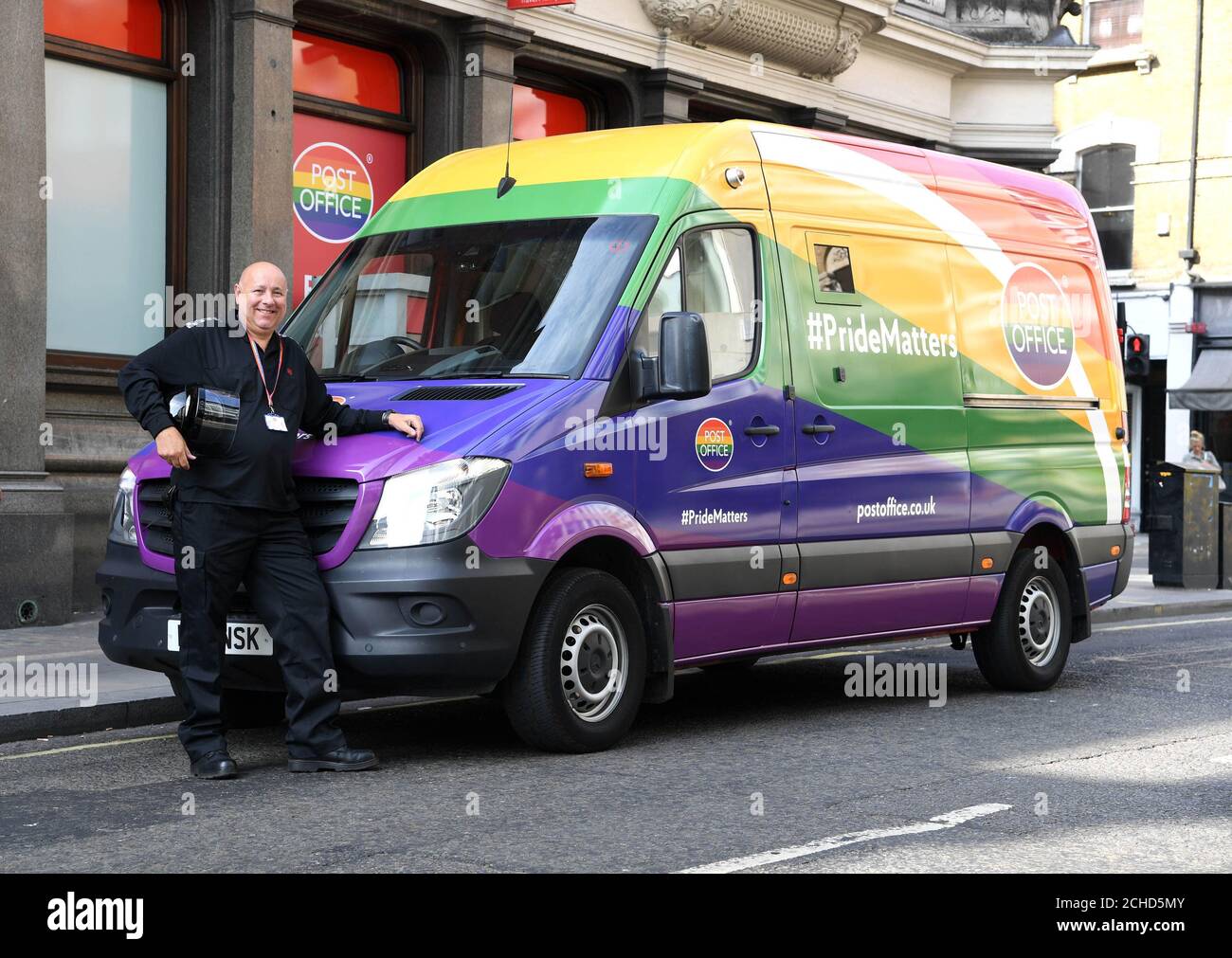 EDITORIAL USE ONLY Driver John Avery with a special edition rainbow wrapped  delivery van in central London as the Post Office celebrates Pride this  year Stock Photo - Alamy