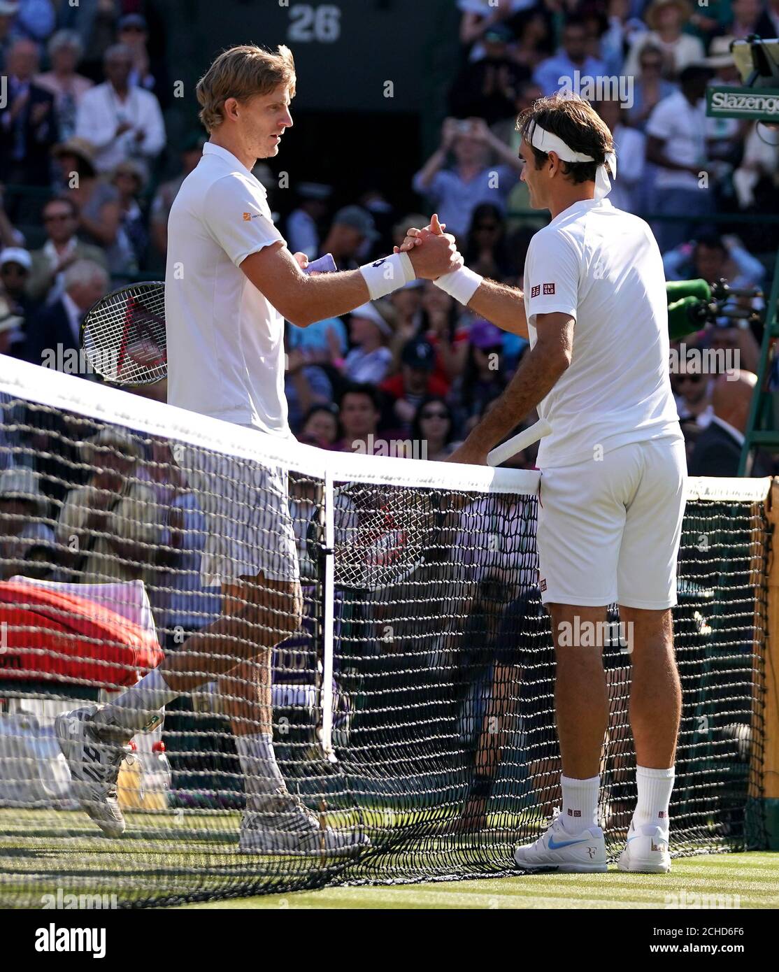 Kevin Anderson (left) shakes hands with Roger Federer after his win on day  nine of the Wimbledon Championships at the All England Lawn tennis and  Croquet Club, Wimbledon Stock Photo - Alamy