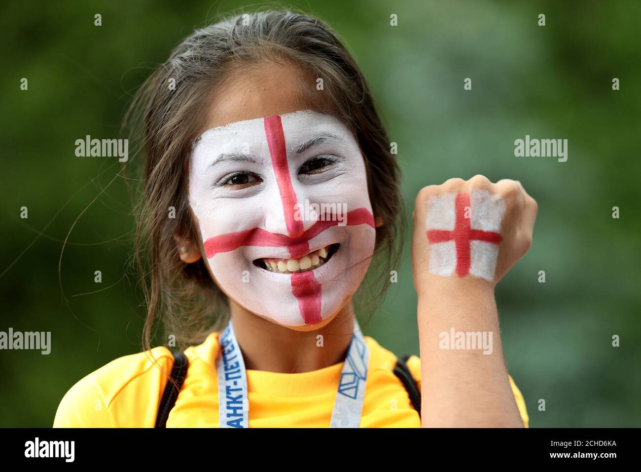 An England fan wears face paint of the St George's Cross flag during the FIFA World Cup, Semi Final match at the Luzhniki Stadium, Moscow. Stock Photo