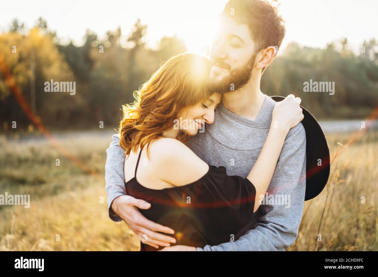 Pretty young romantic couple spend time together outdoor Stock Photo ...