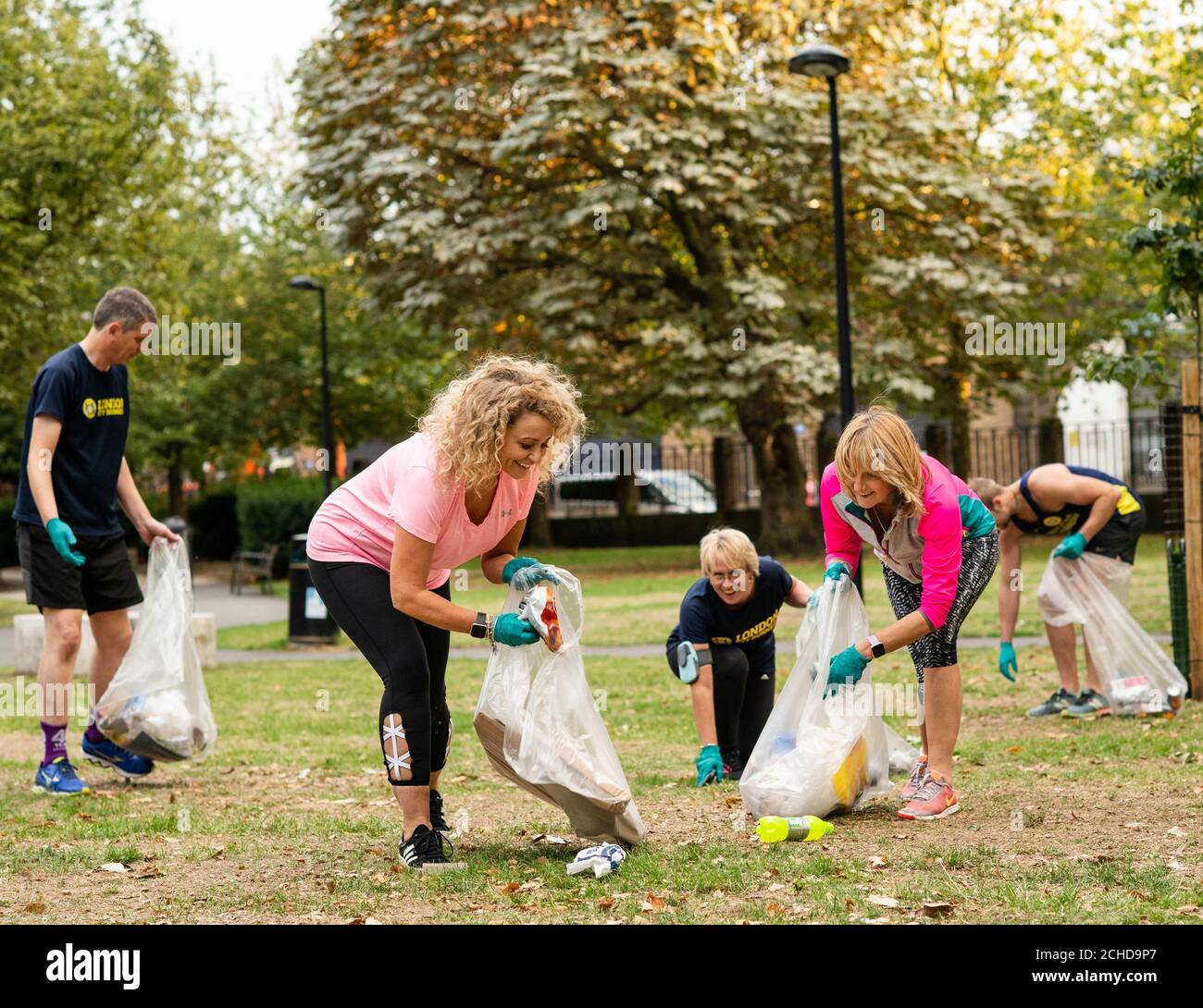 Nadia Sawalha and Kaye Adams go Plogging, which is a Scandinavian fitness trend where people pick up plastic whilst out walking or running, with Fitbit and London City Runners in support of WasteAid, in central London. Stock Photo