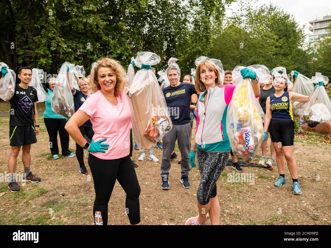EDITORIAL USE ONLY  Nadia Sawalha and Kaye Adams go ÔPloggingÕ, which is a Scandinavian fitness trend where people pick up plastic whilst out walking or running, with Fitbit and London City Runners in support of WasteAid, in central London. Stock Photo