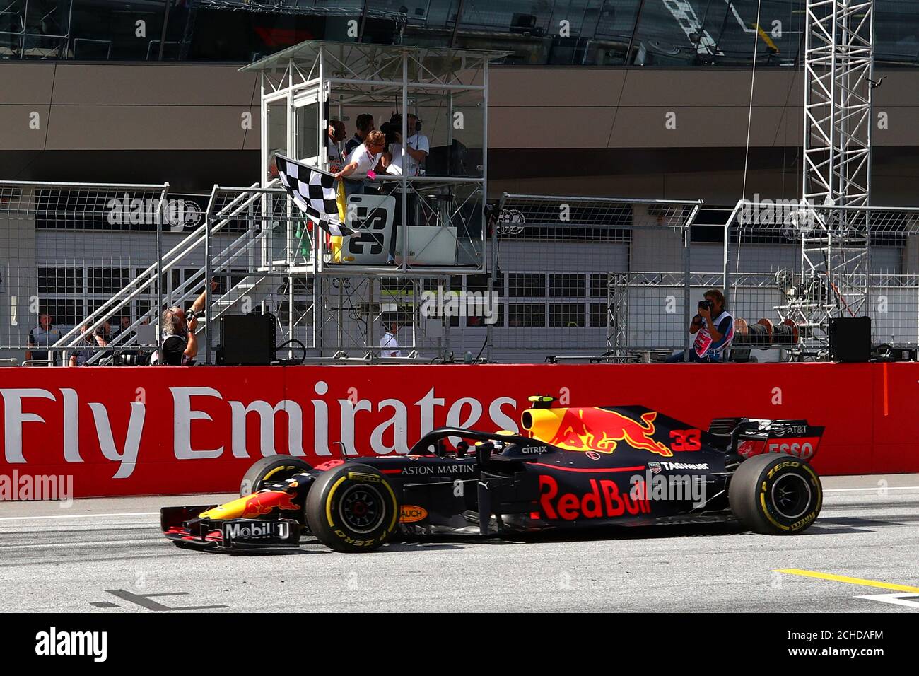 F1 Formula One - Austrian Grand Prix - Red Bull Ring, Spielberg, Austria -  July 1, 2018 Red Bull's Max Verstappen crosses the finish line to take the  chequered flag and win