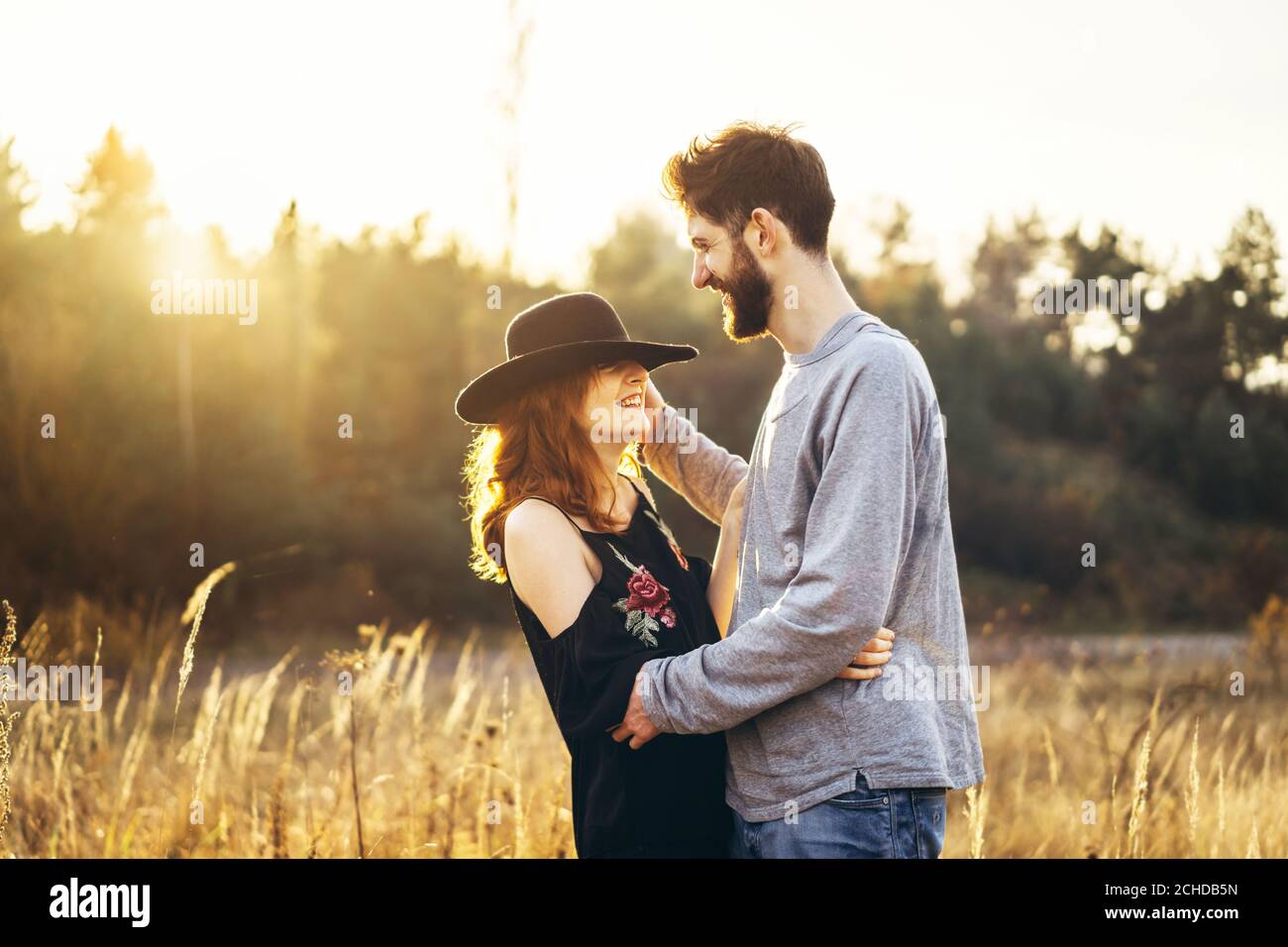 Pretty young romantic couple spend time together outdoor Stock Photo ...