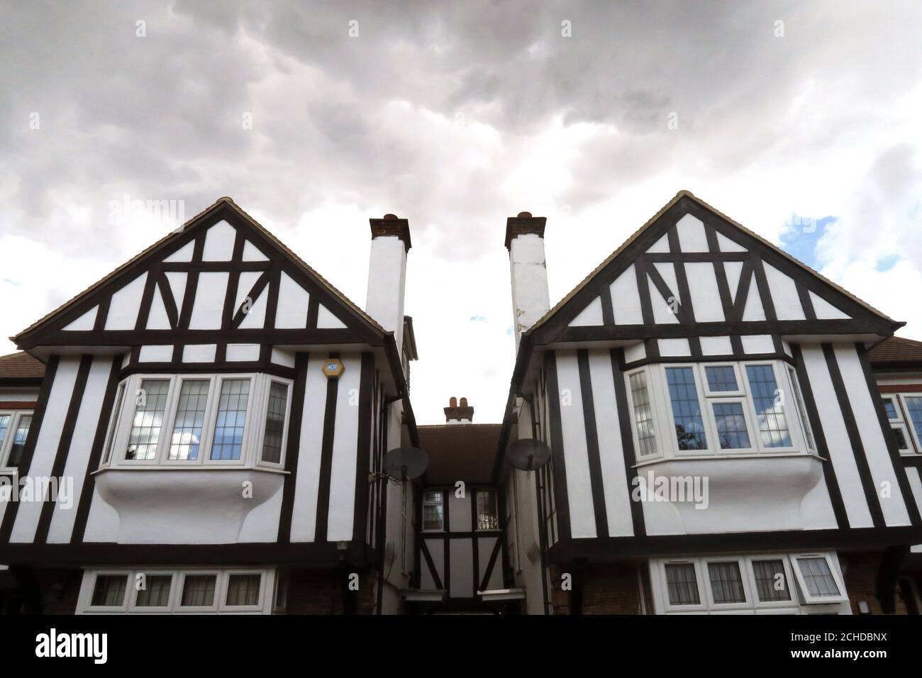London Mock Tudor houses under stormy sky Stock Photo