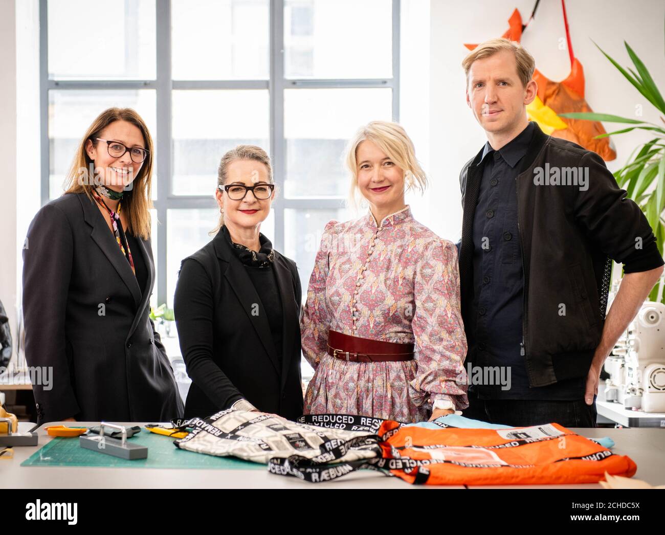 EDITORIAL USE ONLY (Left to right) Caroline Rush CBE, Chief Executive of the British Fashion Council, Professor Frances Corner OBE, Head of London College of Fashion, UAL, Justine Simons OBE, Deputy Mayor for Culture and the Creative Industries, designer Christopher Raeburn, at the launch of the Fashion District, which is a new hub for fashion innovation that aims to return world-leading fashion manufacturing and design to the east end, held at Christopher's studio in London. Stock Photo