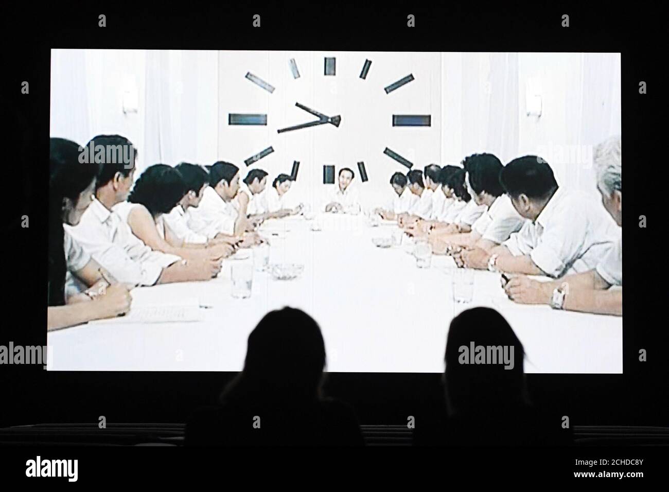 A scene from Christian Marclay's 24-hour video installation, The Clock, at Tate Modern in London. Stock Photo