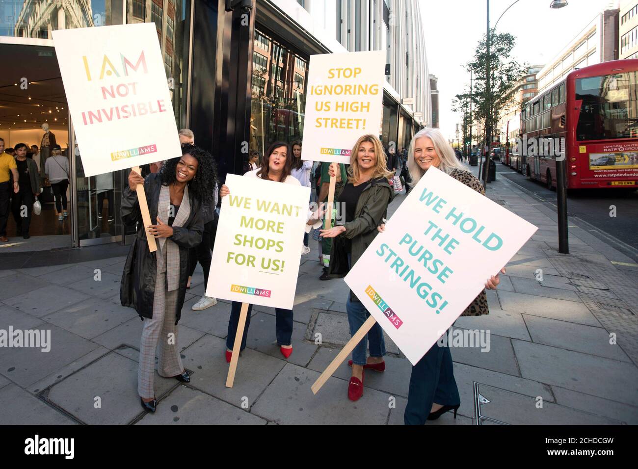 (left to right) Melanie Torino, aged 50, Kay Boggett, aged 44, Jilly Johnson, aged 64 and Rachel Peru, aged 47 on Oxford Street in a protest against the lack of offering on UK high streets for older women, ahead of the JD Williams Midster catwalk, in London. Stock Photo