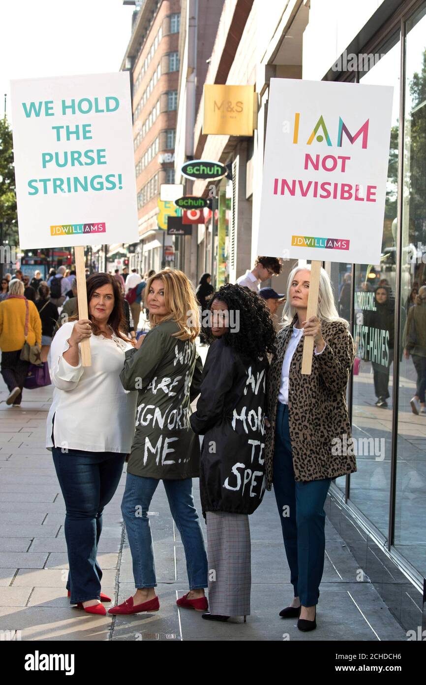 EDITORIAL USE ONLY (left to right) Kay Boggett, aged 44, Jilly Johnson, aged 64, Melanie Torino, aged 50, Rachel Peru, aged 47 on Oxford Street in a protest against the lack of offering on UK high streets for older women, ahead of the JD Williams Midster catwalk, in London. Stock Photo