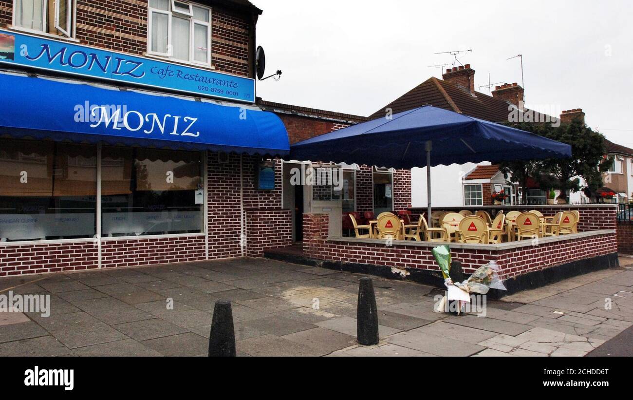 Flowers left near the scene at the Moniz cafe in Hounslow, west London after toddler Kelly Abreu suffered fatal head injuries in unexplained circumstances outside the restaurant. Stock Photo