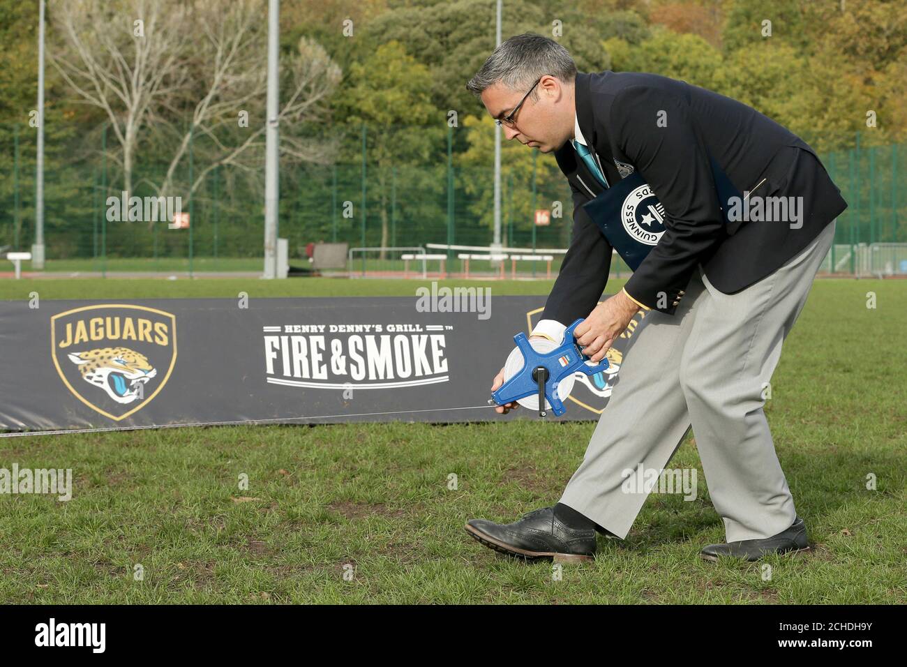 Guinness World Record adjudicator Jack Brockbank measures the throwing