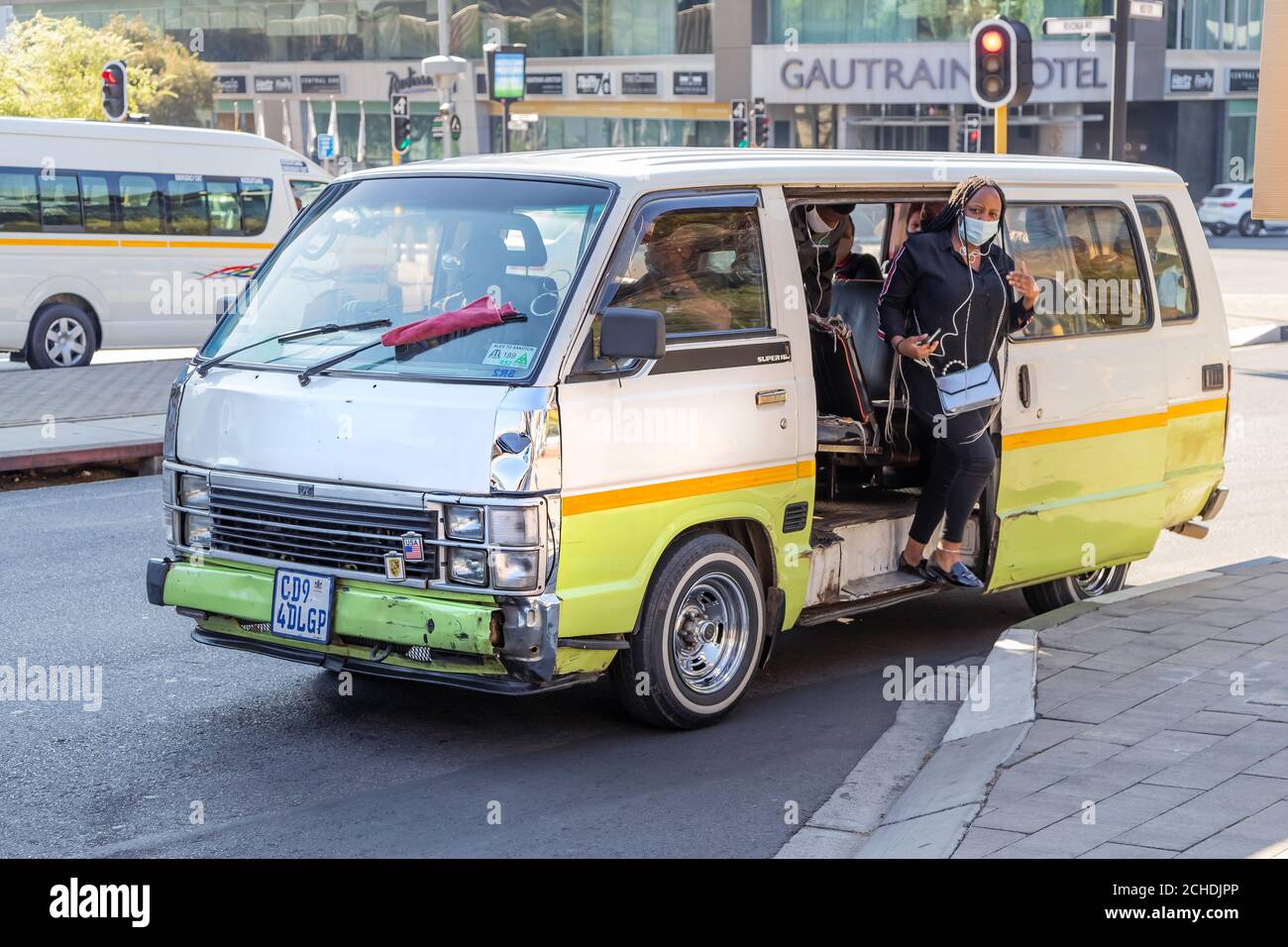 Johannesburg, South Africa, 11th September - 2020: Passenger getting out of mini bus taxi in city centre. Stock Photo