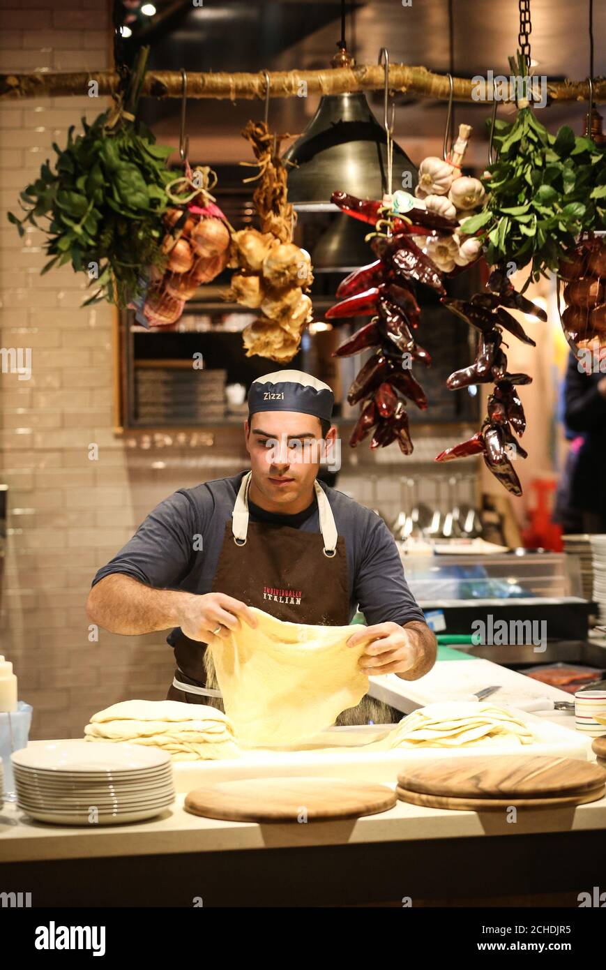 EDITORIAL USE ONLY Chef Paschalis Strantzias at work making pizza dough as Zizzi's Salisbury restaurant is officially reopened, eight months after it was caught up in the poisoning of a former Russian intelligence officer and his daughter. Stock Photo