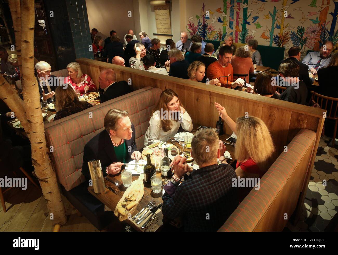 EDITORIAL USE ONLY (Foreground table, left to right) Darren and Gosia McDonald, Steven Jones and Sarah Orton attend the official reopening of Zizzi's Salisbury restaurant, eight months after it was caught up in the poisoning of a former Russian intelligence officer and his daughter. Stock Photo