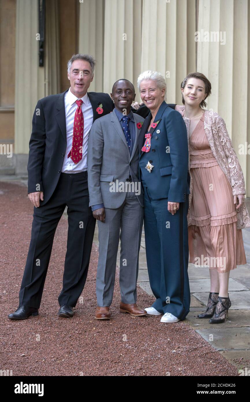 Actress Emma Thompson, with her husband Greg Wise and children Gaia Wise and Tindy Agaba, leaves Buckingham Palace, London, after she received her damehood at an Investiture ceremony. Stock Photo