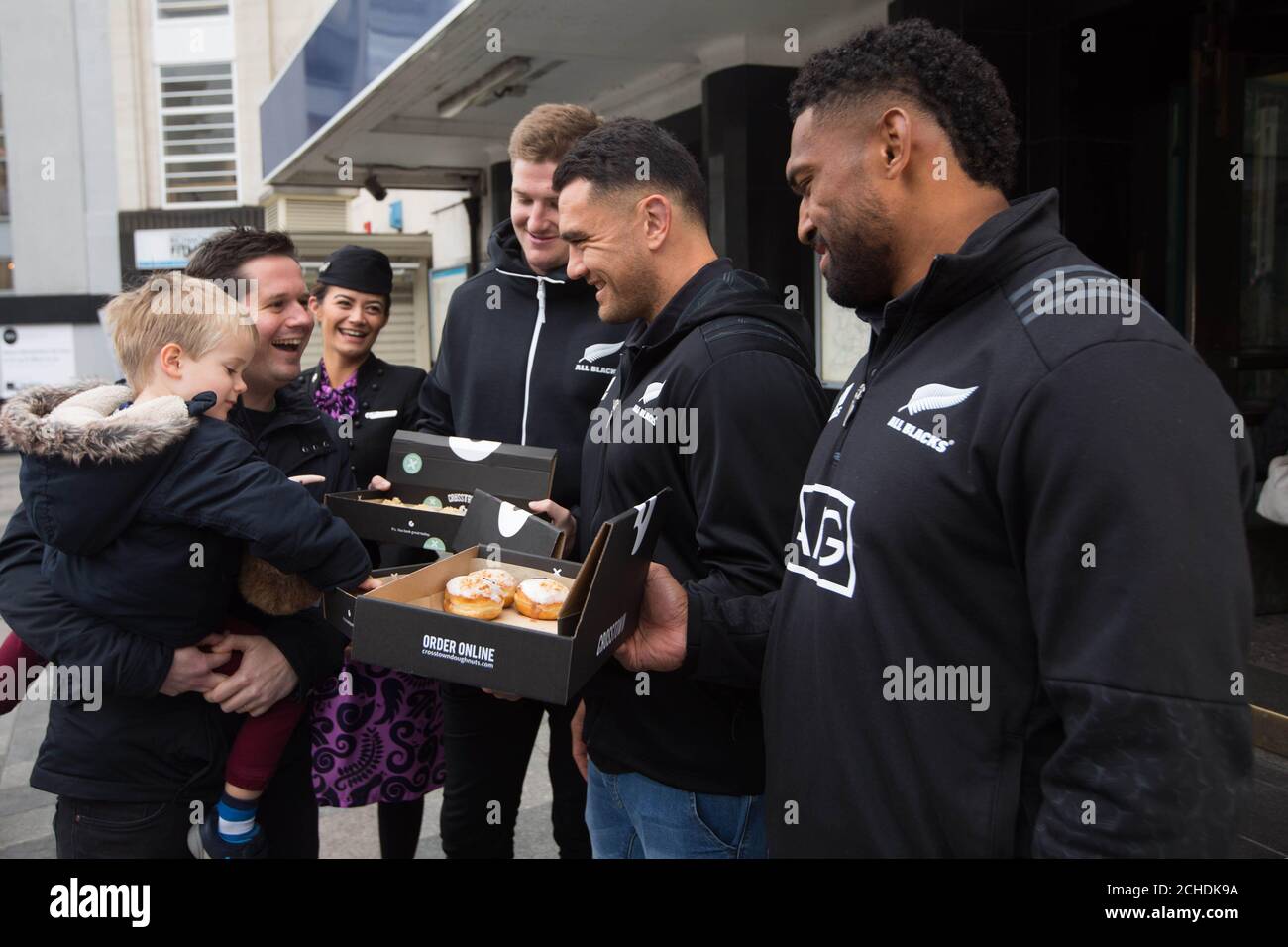 EDITORIAL USE ONLY All Blacks rugby stars Jordie Barrett, Codie Taylor and Waisake Naholo with cabin crew Katrina Green take time out of their training schedule to give commuters in Richmond a