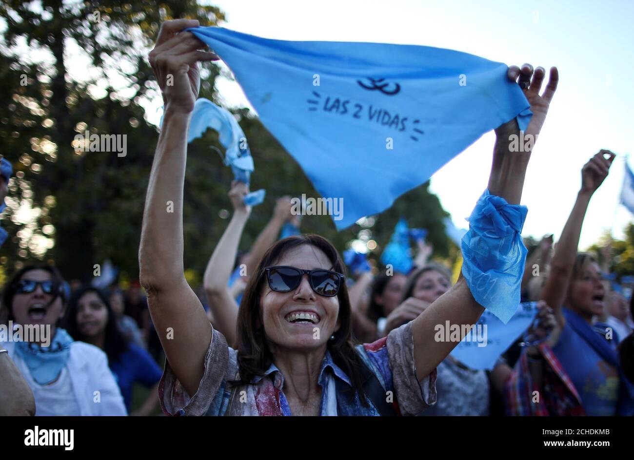 A woman shows a light blue handkerchief, which symbolises the anti-abortion movement, during an anti-abortion demonstration, in Buenos Aires, Argentina. March 23, 2019. REUTERS/Agustin Marcarian Stock Photo
