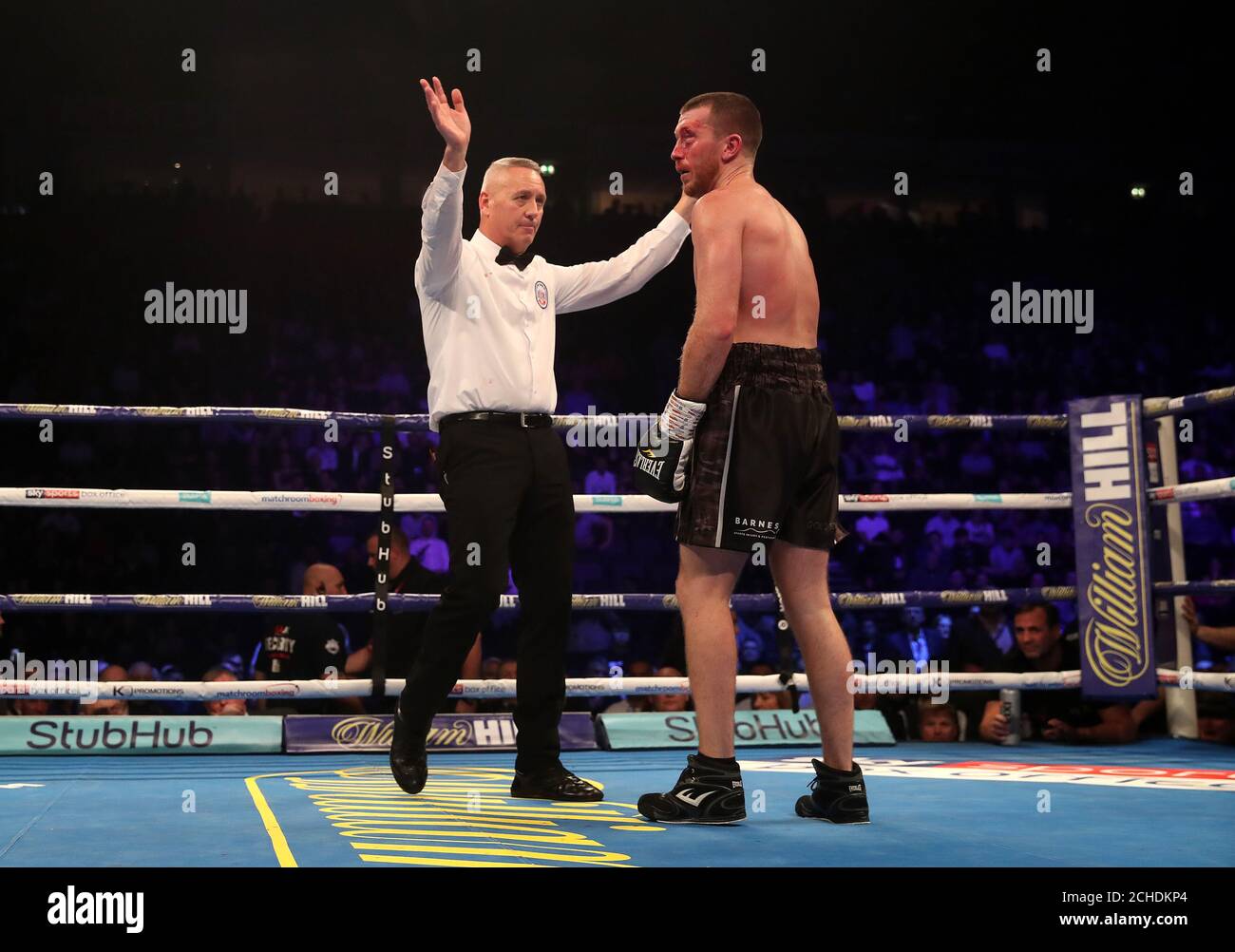 The referee stops the fight after Ricky Burns knocks down Scott Cardle