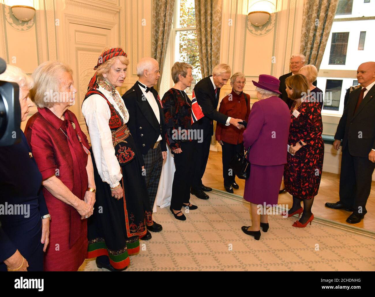 Queen Elizabeth II meets guests at the Anglo-Norse Society centenary reception at the Naval and Military Club in central London. Stock Photo