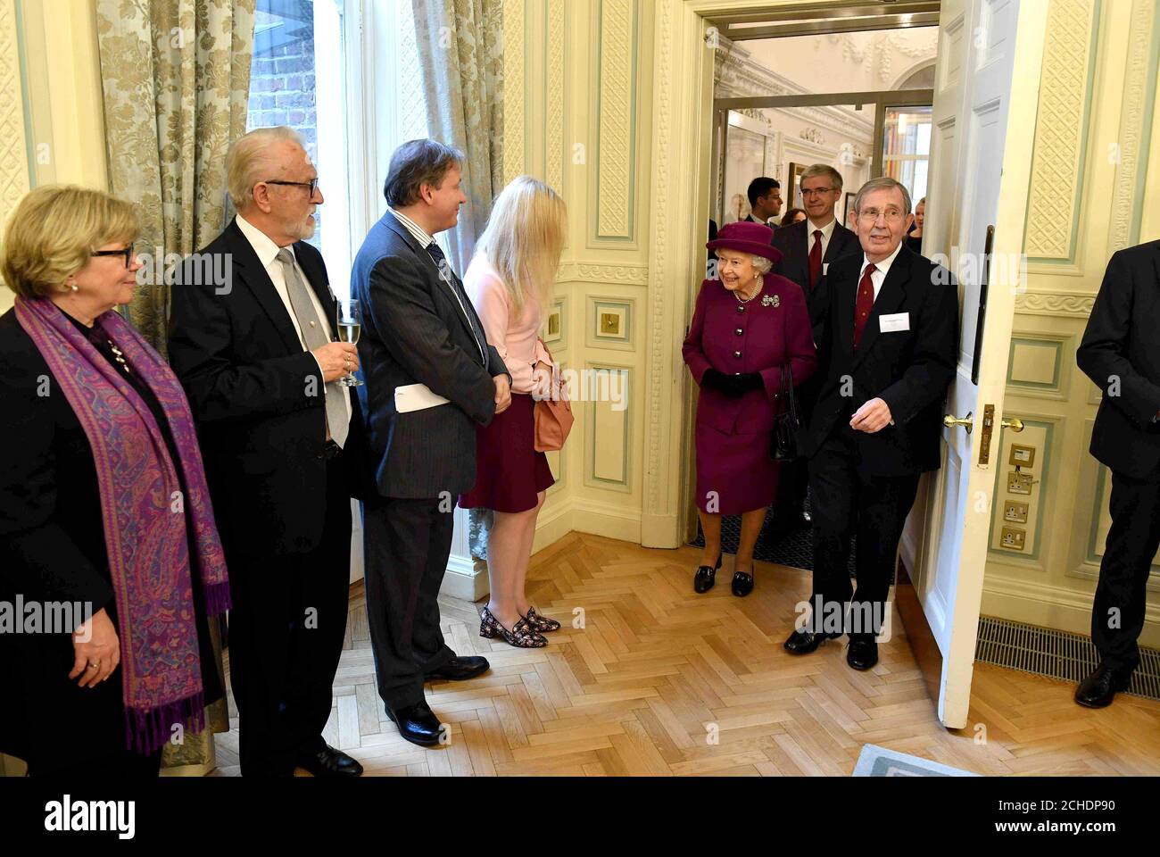 Queen Elizabeth II meets guests at the Anglo-Norse Society centenary reception at the Naval and Military Club in central London. Stock Photo