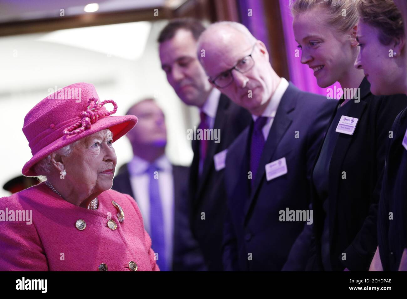 Queen Elizabeth II greets staff during a visit to the Royal Institution of Chartered Surveyors (RICS) in London, to mark its 150th anniversary. Stock Photo