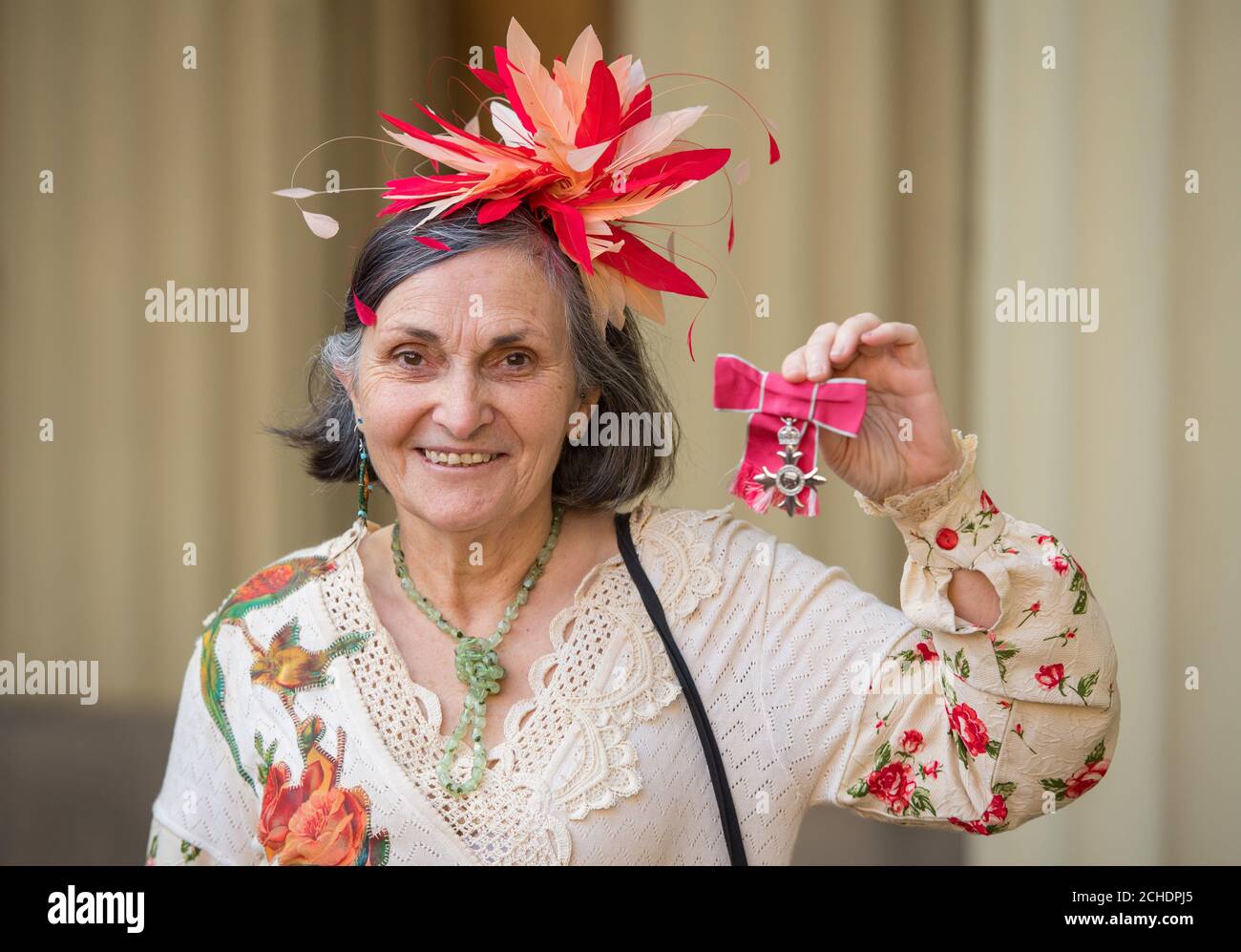 Susan Martin with her MBE medal, which was presented at an investiture ceremony at Buckingham Palace, London. Stock Photo