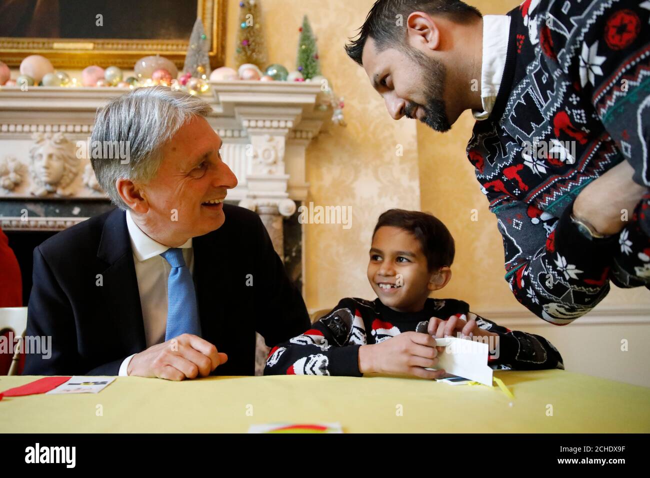 Chancellor Philip Hammond chats with guests at a Christmas party for the Starlight Children's Foundation at 11 Downing Street, London. Stock Photo