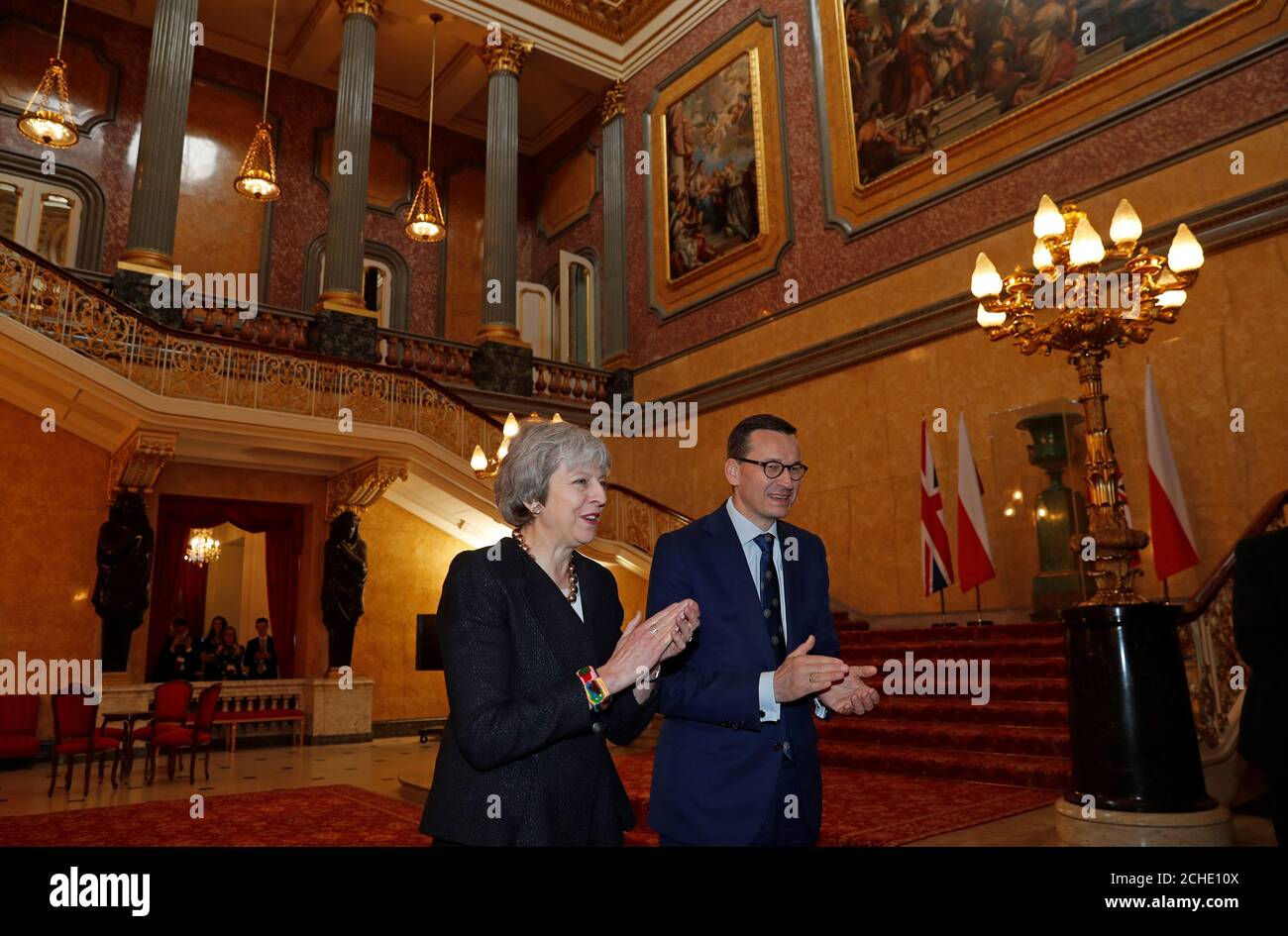 Prime Minister Theresa May and Poland's Prime Minister Mateusz Morawiecki applaud after hearing a choir sing during the UK-Poland Inter-Governmental Consultations at Lancaster House, London. Stock Photo