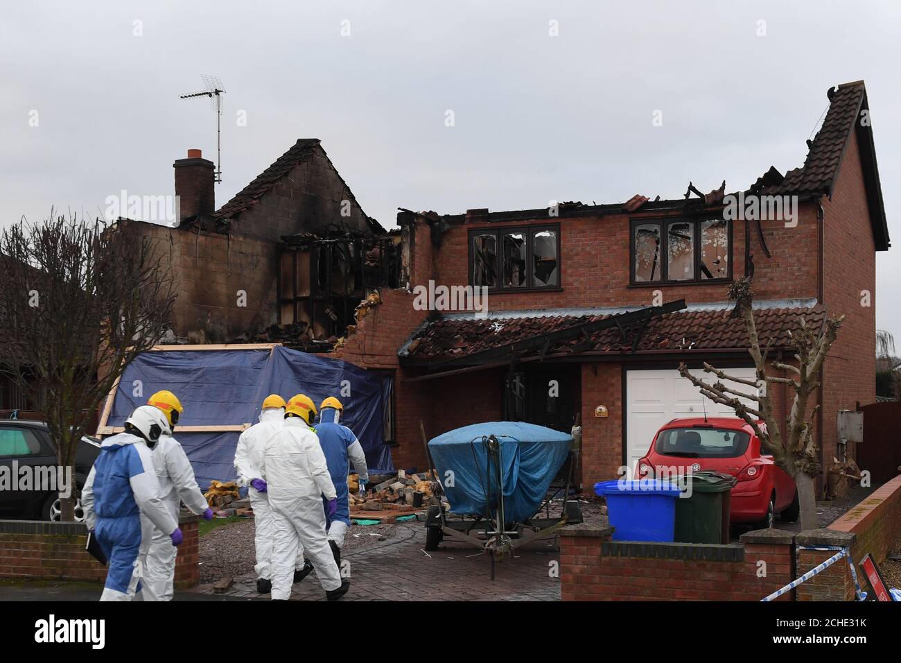 Investigators at the scene following a house fire in Peartree Road