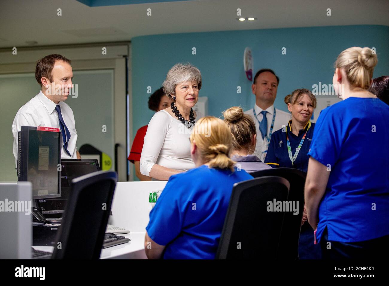 Health and Social Care Secretary Matt Hancock (left), Prime Minister Theresa May and NHS England Chief Executive Simon Stevens visiting the wards at Alder Hey Children's Hospital, Liverpool where they launched the NHS Long Term Plan. Stock Photo
