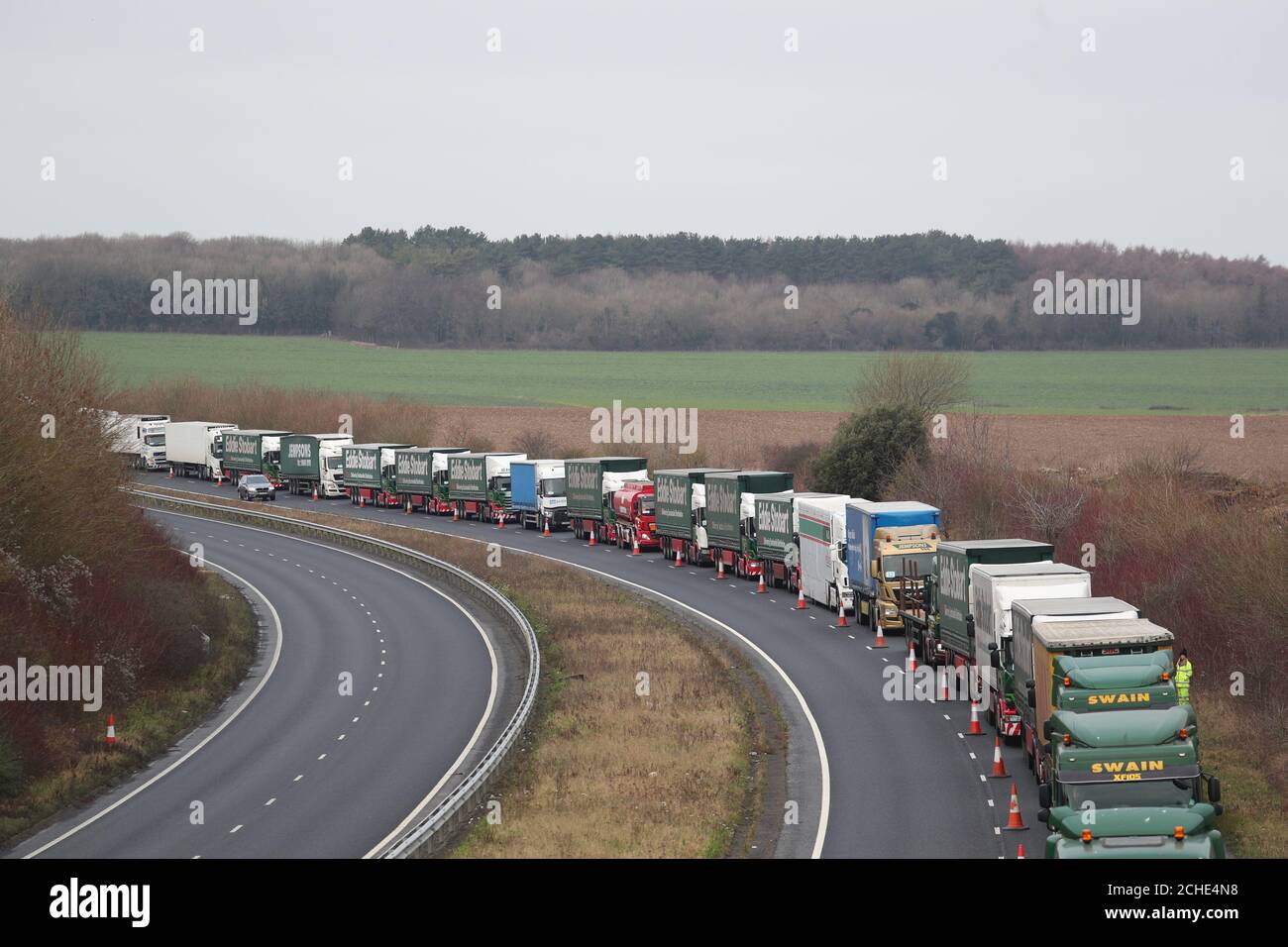 Lorries form up on the A256 outside Dover for the second of two trials at the former Manston Airport site in Kent of a government plan to hold lorries in the event of post-Brexit disruption at the channel ports. Stock Photo
