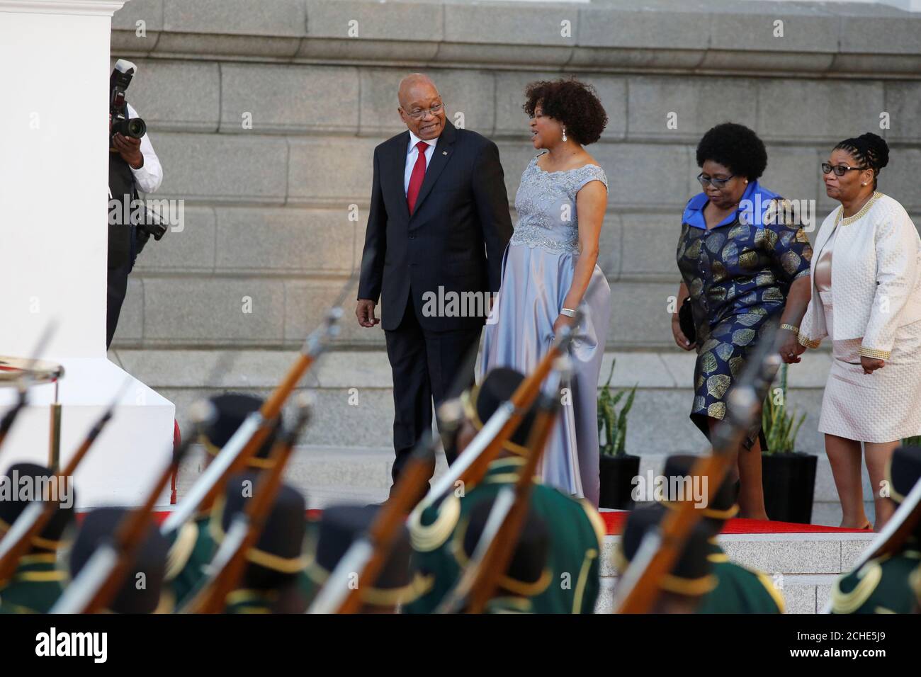 South Africa's President Jacob Zuma reviews the honor guard ahead of his  State of the Nation Address (SONA) to a joint sitting of the National  Assembly and the National Council of Provinces